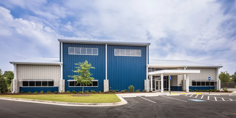 Blue pre-engineered building used as a training facility for Plumbers and Steam Fitters Union of the CSRA-Local 150