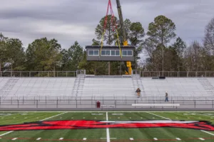 Placing a pressbox on a stadium via crane