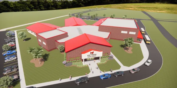 Rendering of new middle school by aerial view. School is brick with red roof and designed in a radial layout