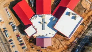 Aerial photo of the new middle school. Graphic shows red roof, and the school's radial layout