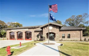 3-bay fire station with American flag and South Carolina state flag waving